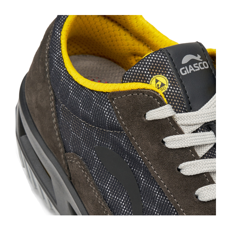 Nahaufnahme des Giasco 3Move ESD Leopard S1P Sicherheitsschuhs mit grauem Mesh, Veloursleder, gelbem Innenfutter, ESD-Schutz und ergonomischer Passform