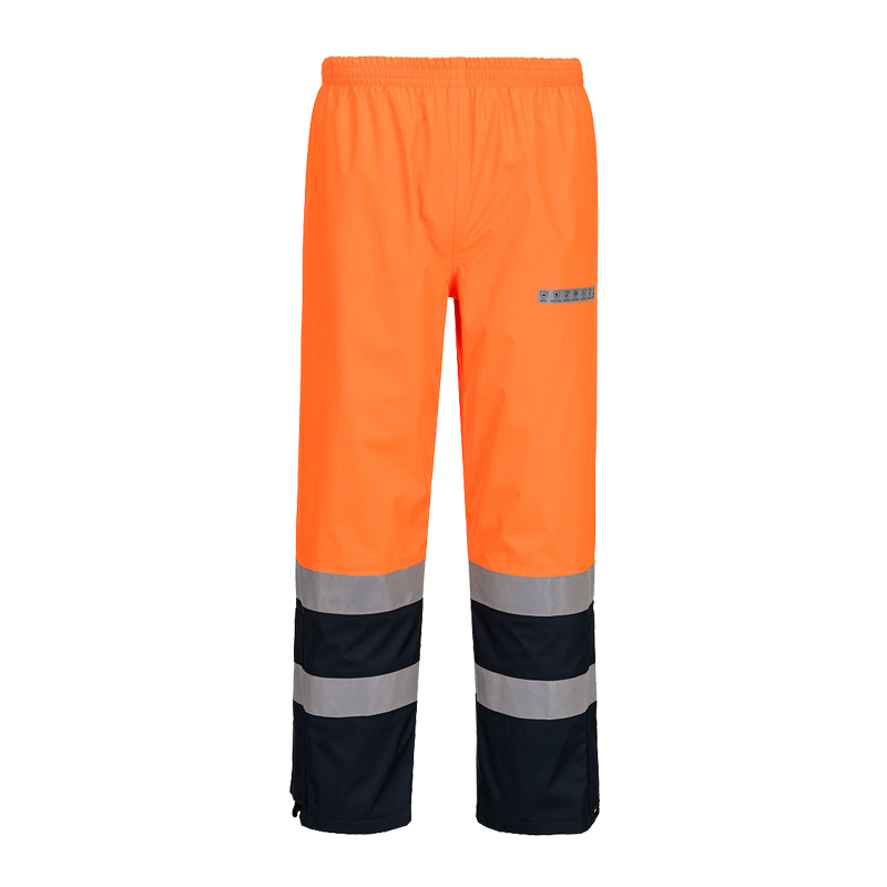 PortWest Warnschutzhose in leuchtendem Orange mit silbernen Reflexstreifen und dunkelblauen Beinpartien, frontale Produktansicht